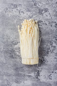 Enoki mushrooms - popular ingredient in asian cuisine. Edible needle mushroom or Enokitake