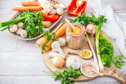 Homemade vegetable broth powder, organic vegetable stock, with raw vegetables, mushrooms and herbs