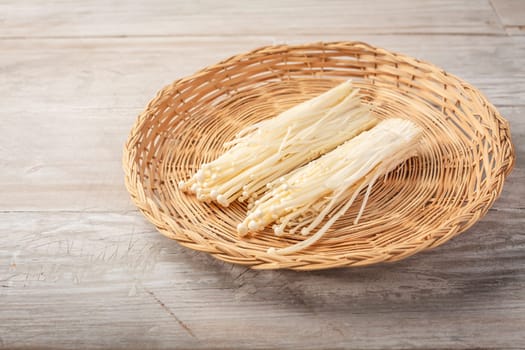 Enoki mushrooms - popular ingredient in asian cuisine. Edible needle mushroom or Enokitake