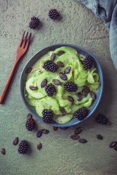 Cucumber salad with blackberries and yogurt dressing and seeds