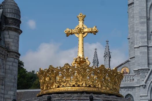 the gilded crown of the lourdes basilica
