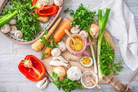 Homemade vegetable broth powder, organic vegetable stock, with raw vegetables, mushrooms and herbs