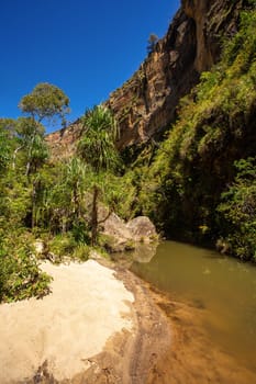 Isalo National Park in Ihorombe Region. Wilderness landscape with water erosion into rocky outcrops, plateaus, extensive plains and deep canyons. Beautiful Madagascar landscape.