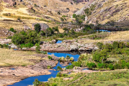 Andringitra national park, Haute Matsiatra region, Madagascar, beautiful mountain landscape with river in valley. Hiking in Andringitra mountains. Sunny day. Madagascar wilderness mountain landscape.