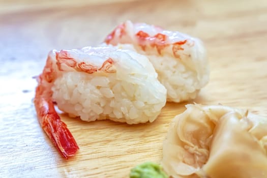 Sashimi sushi on the wood table. Sushi is a type of food preparation originating in Japan.