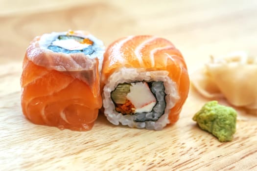 Sashimi sushi on the wood table. Sushi is a type of food preparation originating in Japan.