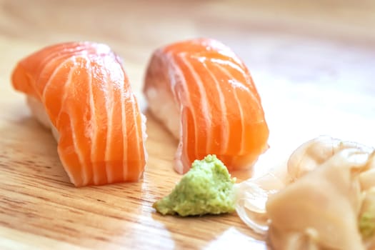 Sashimi sushi on the wood table. Sushi is a type of food preparation originating in Japan.
