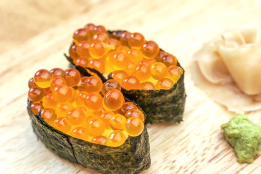 Sashimi sushi on the wood table. Sushi is a type of food preparation originating in Japan.