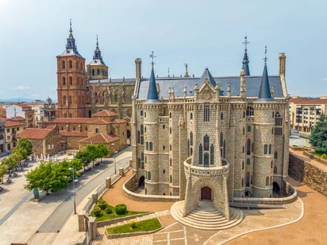Episcopal Palace of Astorga, is a building by Catalan architect Antoni Gaudi in Astorga, in the background the Saint Maria Cathedral, Spain. Aerial view