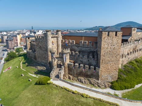 Templar castle in Ponferrada, Leon Spain medieval stone walls, towers, flags