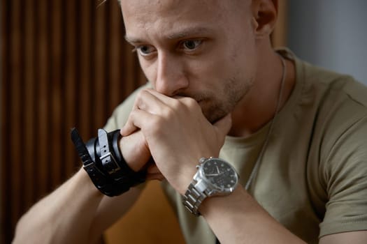 Closeup face portrait of emotional military man feeling stress and depression. Ptsd symptom