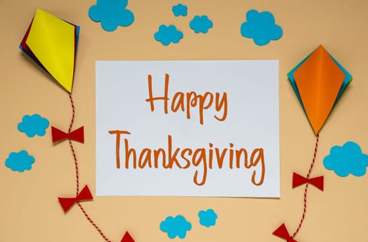 Autumn Background With Paper Kites, Clouds and Fall Decoration, With Text Happy Thanksgiving