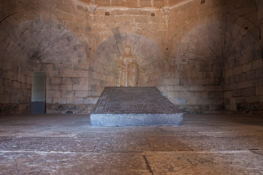 Beja, Portugal - Jul 27th, 2023: Visitors sitting beside interior window bench of the fortress. Beja Castle, Baixo Alentejo, Portugal