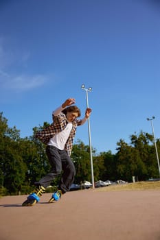 Active teen rollerblading on street having training class for practicing free riding