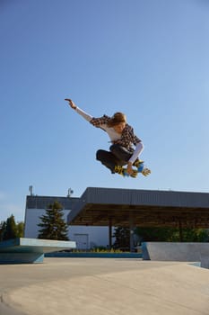 Roller skating concept, young male skater jumping high on ramp. Teenager boy enjoying speed rollerblading in park