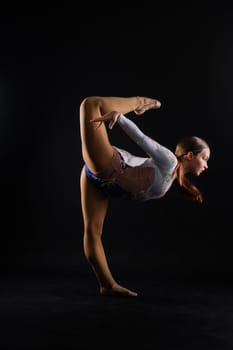 High jump, flight. Flexible girl, rhythmic gymnastics artist jumping. Grace motion action