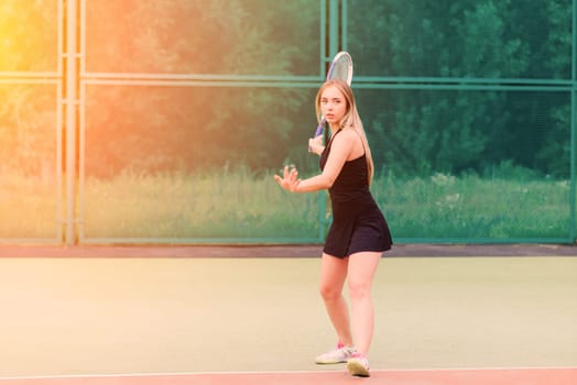 Tennis tournament. Female player at clay tennis court