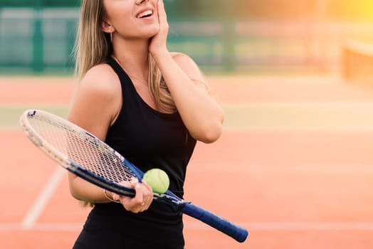 Tennis tournament. Female player at clay tennis court