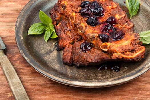 Fried pork ribs with blueberry sauce