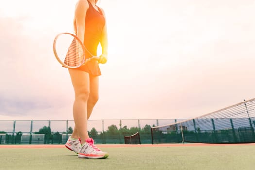 Tennis tournament. Female player at clay tennis court