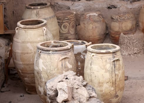 Santorini, Greece - July 01, 2021: Recovered ancient pottery in prehistoric town of Akrotiri, excavation site of a Minoan Bronze Age settlement on the Greek island of Santorini