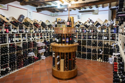 Montalcino, Italy - September 12, 2022: Interior of a wine shop in Montalcino ,Tuscany, Italy. Montalcino is famous for its Brunello di Montalcino wine.