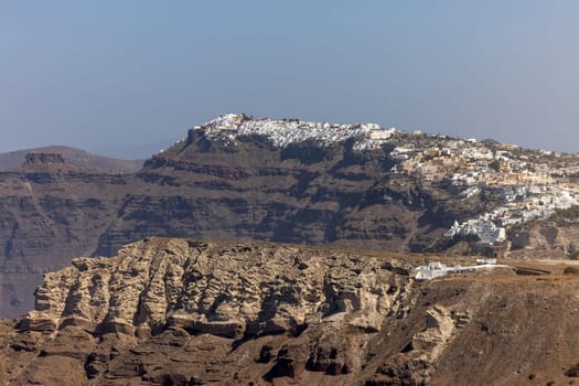Magnificent view of the majestic volcanic cliffs of Santorini Island, Greece.