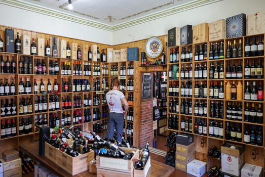 Montalcino, Italy - September 12, 2022: Interior of a wine shop in Montalcino ,Tuscany, Italy. Montalcino is famous for its Brunello di Montalcino wine.