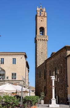 Montalcino, Italy - September 12, 2022: Piazza Garibaldi and Palazzo dei Priori in Hilltop town of Montalcino,Tuscany,Italy