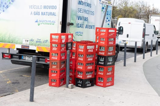 22 february 2023 Lisbon, Portugal: stack box of coca-cola on the street by the truck. Mid shot