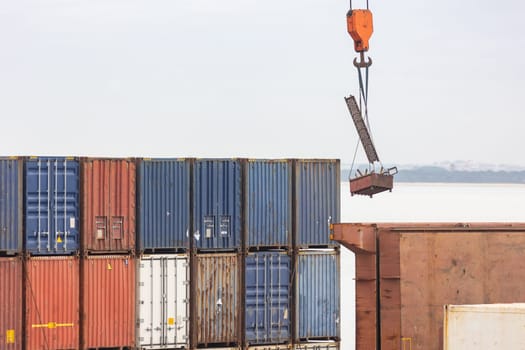 A bunch of cargo containers in the open air. Mid shot