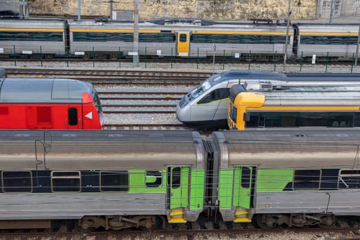 Bullet trains stand on the rails at the railway depot. Aerial view