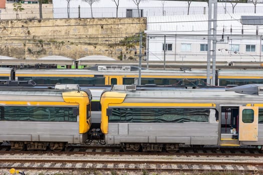 Trains stand on the rails at the railway depot. Mid shot