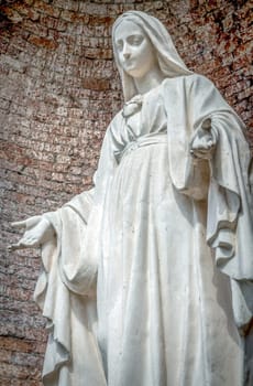 Close-up of Our Lady with open arms, bottom view. Religion, concepts.