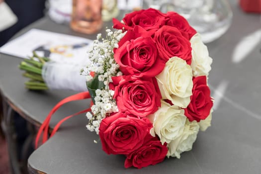 Flower bouquet of marriage, on blurred background. Party, event.