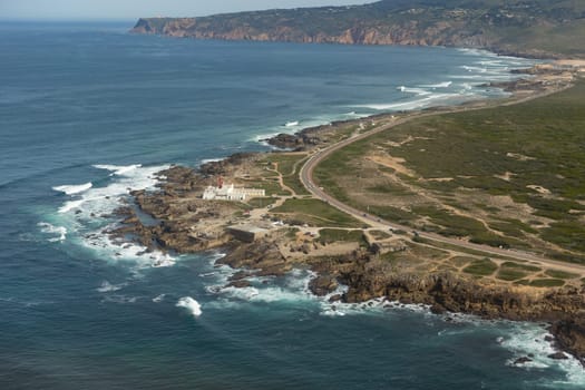 A bird's-eye view of an island by the sea. Aerial shot