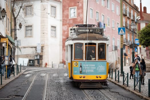 21 April 2023 Lisbon, Portugal: Little cute tram in Lisbon - sight of Lisbon. Mid shot