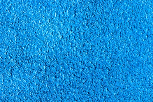 Blue cement wall texture for background and copy space for text. Blue paper background.