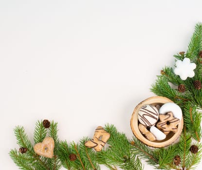 Nurnberg elisen gingerbread mix, traditional german christmas sweets with fir branches and pine cones, holiday background with copy space