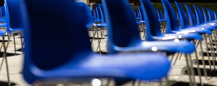 desolating rows of empty seats, in a place commonly used for outdoor performances now abandoned and waiting for the end of the pandemic, with the risk of business failure, night scene