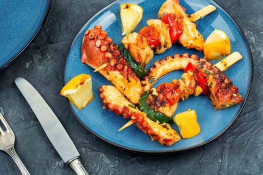 Kebabs of octopus, squid and vegetables on a skewer. Diet picnic concept