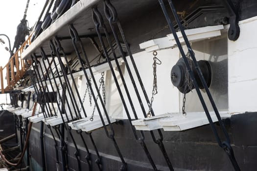 Old tall battle ship in the sea - sail vessel - stand in port