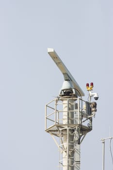 Spinning rotating radar equipment on top of a ship - clear sky