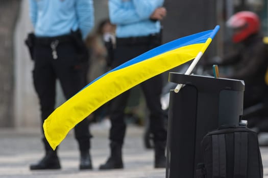 Ukrainian flag at a protest on the street. Mid shot