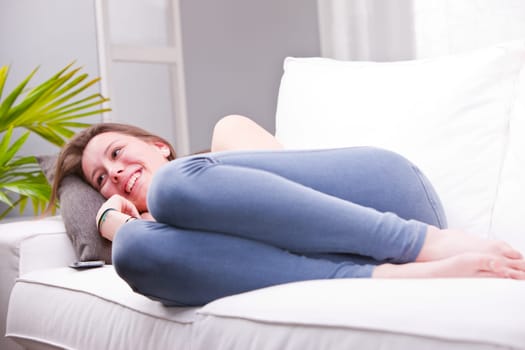 girl laughing and discussing on a sofa