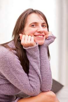 satisfied self-confident woman smiles to the camera