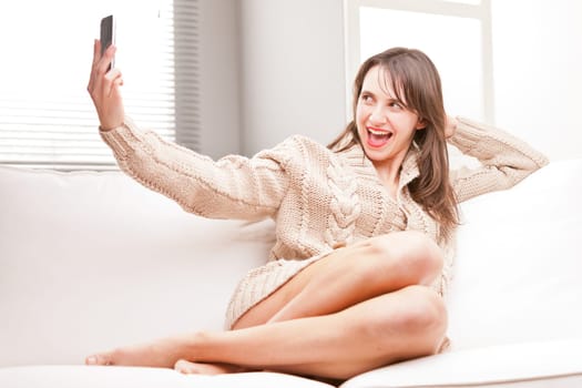 young woman making herself a selfie with her mobile telephone