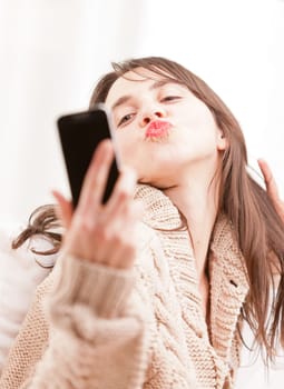 young woman making herself a selfie with her mobile telephone