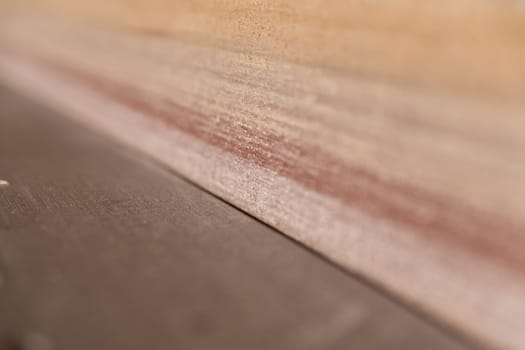 detail of a band saw in a carpenter workshop with a very shallow depth of field