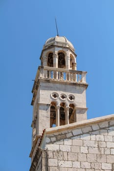 Picturesque classic bell tower of a church in Hvar, Croatia